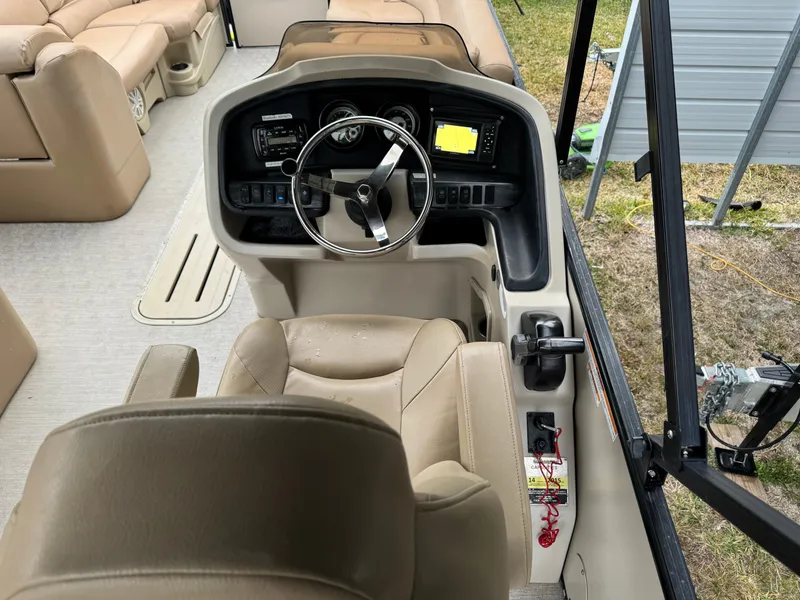 Slide: The Image of Interior view of 2017 Avalon Catalina Rear J Lounger boat cockpit with steering wheel and controls. - 11