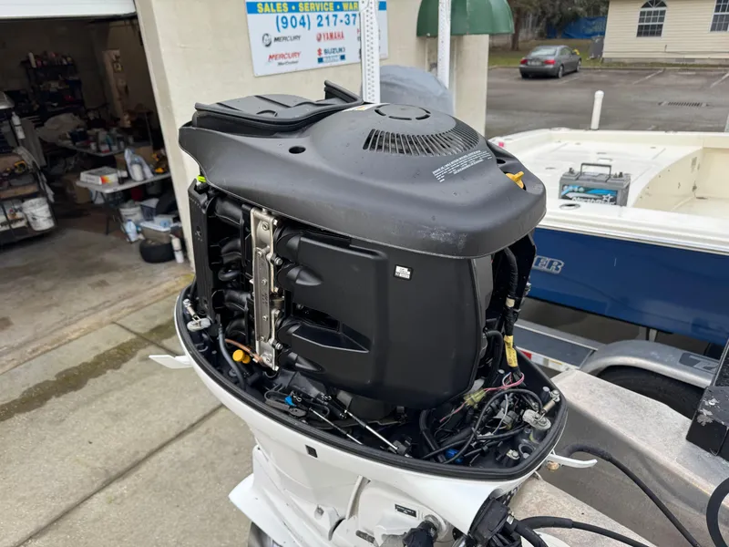 Slide: The Image of Close-up of a 2017 Avalon Catalina boat engine in a service area. - 17