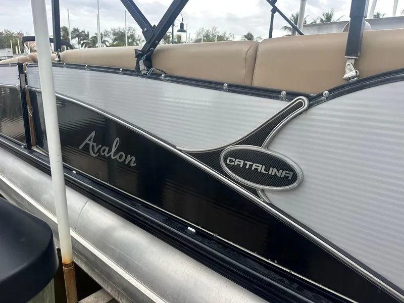 Slide: The Image of 2017 Avalon Catalina Rear J Lounger pontoon boat with sleek design and comfortable seating. - 2
