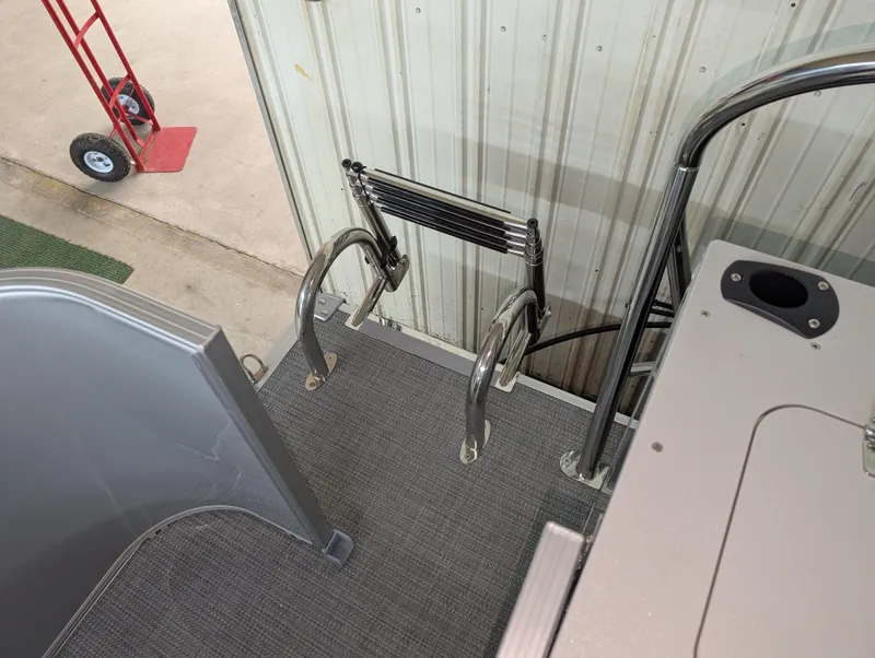 Slide: The Image of 2025 Sylvan Mirage Fish 820 Party Fish 4.0 boat ladder and deck area. - 11