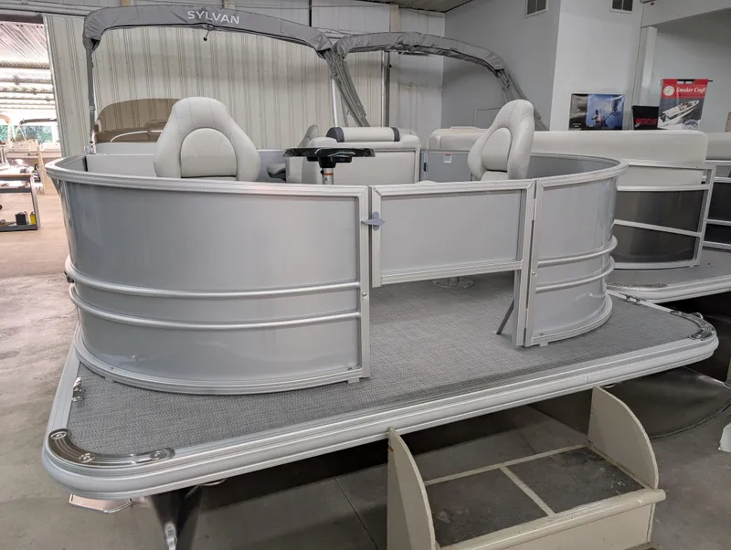 Slide: The Image of 2025 Sylvan Mirage Fish 820 Party Fish pontoon boat in showroom. - 2
