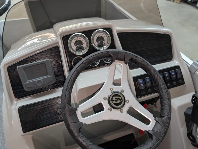 Slide: The Image of 2025 Sylvan Mirage Fish 820 Party Fish dashboard with steering wheel and gauges. - 6