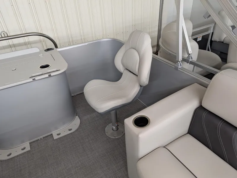Slide: The Image of 2025 Sylvan Mirage Fish 820 Party Fish 4.0 interior with seating and cup holders. - 9