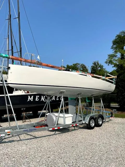 Slide: The Image of 2021 J Boats J 88 sailboat on trailer, parked outdoors. - 4