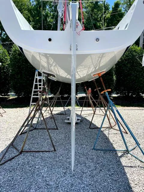 Slide: The Image of 2021 J Boats J 88 sailboat on stands, viewed from the stern. - 6