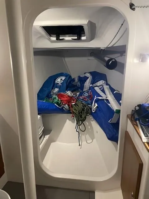 Slide: The Image of Interior of 2021 J Boats J 88 sailboat with ropes and sails stored. - 9