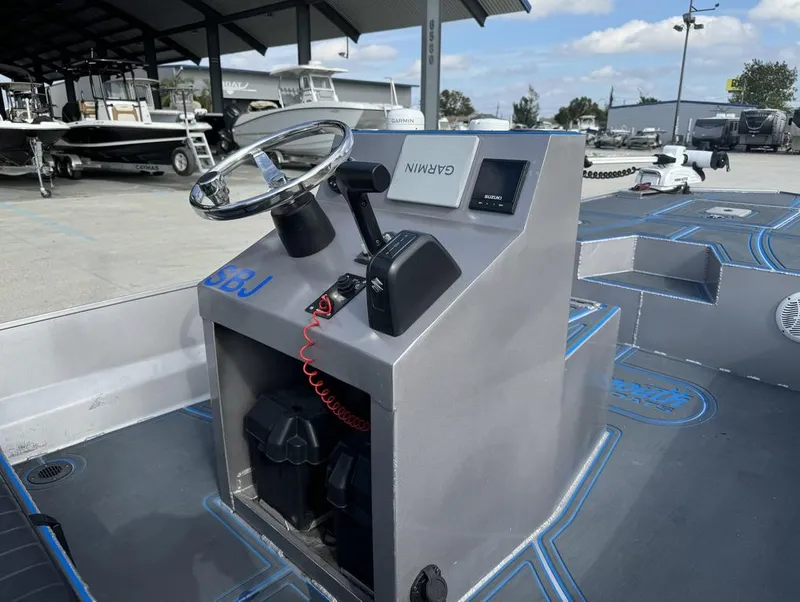 Slide: The Image of Custom Cottonmouth 1860 boat console with Garmin navigation, 2022 model, in a marina setting. - 14