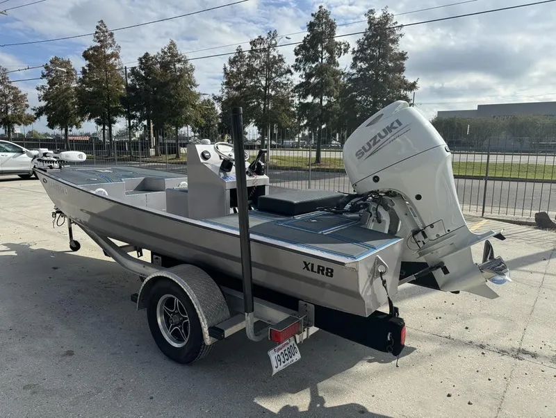 Slide: The Image of Custom Cottonmouth 1860 boat, 2022 model, with Suzuki outboard motor on trailer. - 5
