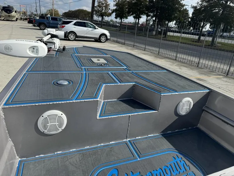 Slide: The Image of Custom Cottonmouth 1860 boat deck, 2022 model, with blue accents and speakers. - 7