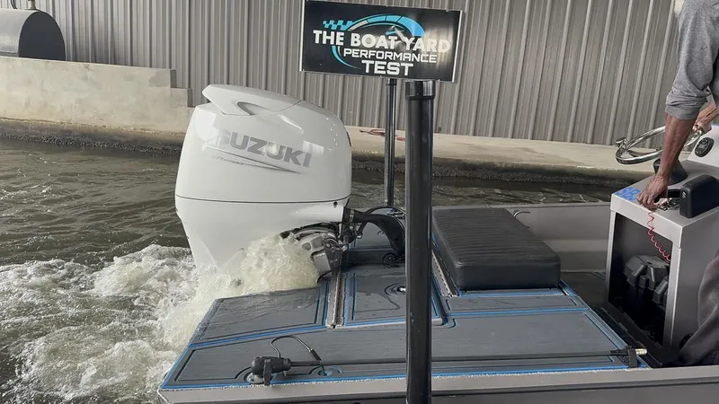 Slide: The Image of Custom Cottonmouth 1860 boat undergoing performance test with Suzuki outboard engine. - 8