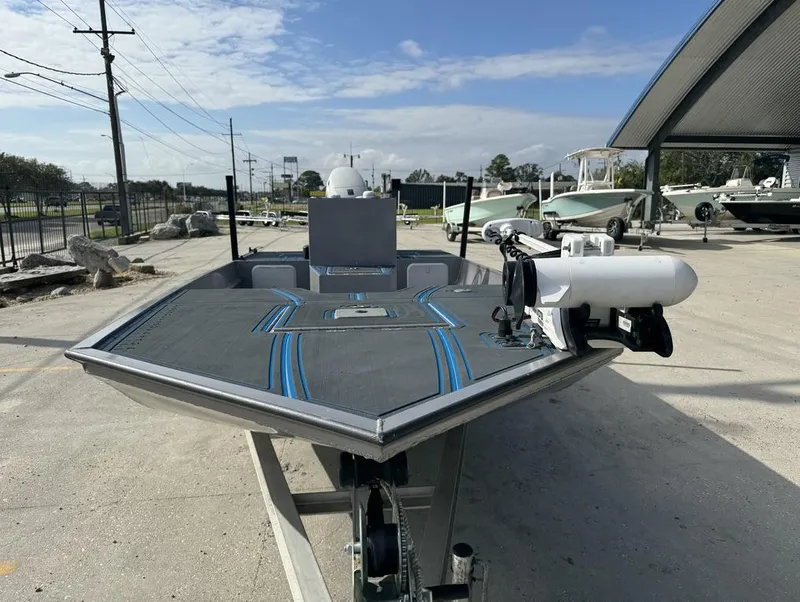 Slide: The Image of Custom Cottonmouth 1860 boat, 2022 model, parked outdoors on a sunny day. - 9