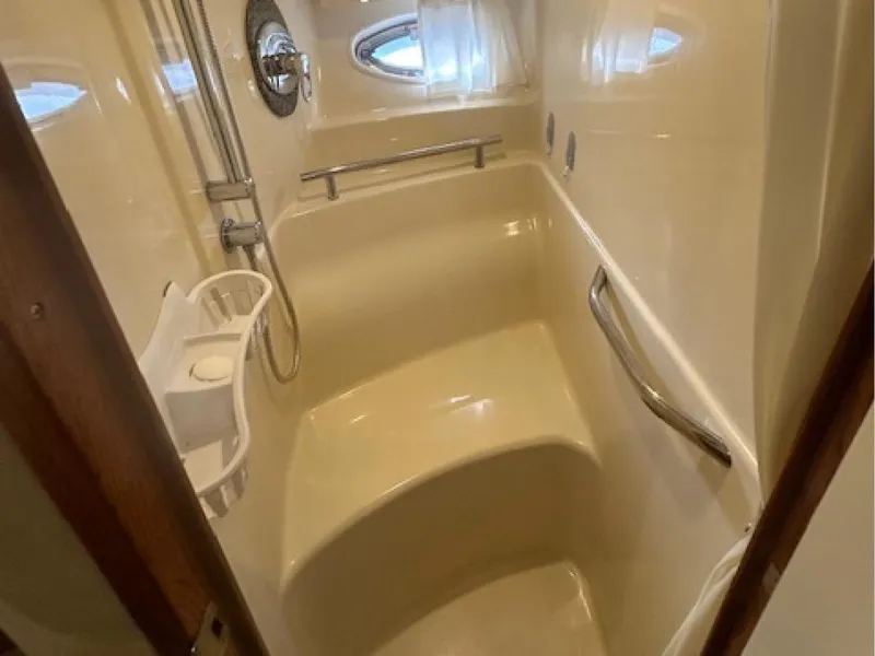 Slide: The Image of Shower area in 2005 Sea Ray 390 Sundancer yacht, featuring sleek design and modern fixtures. - 10