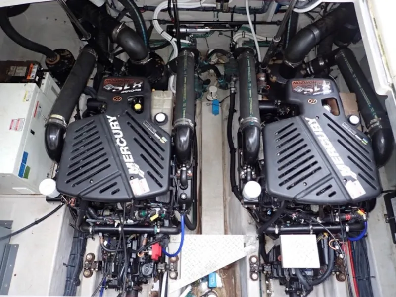 Slide: The Image of Twin Mercury engines in a 2005 Sea Ray 390 Sundancer boat. - 12