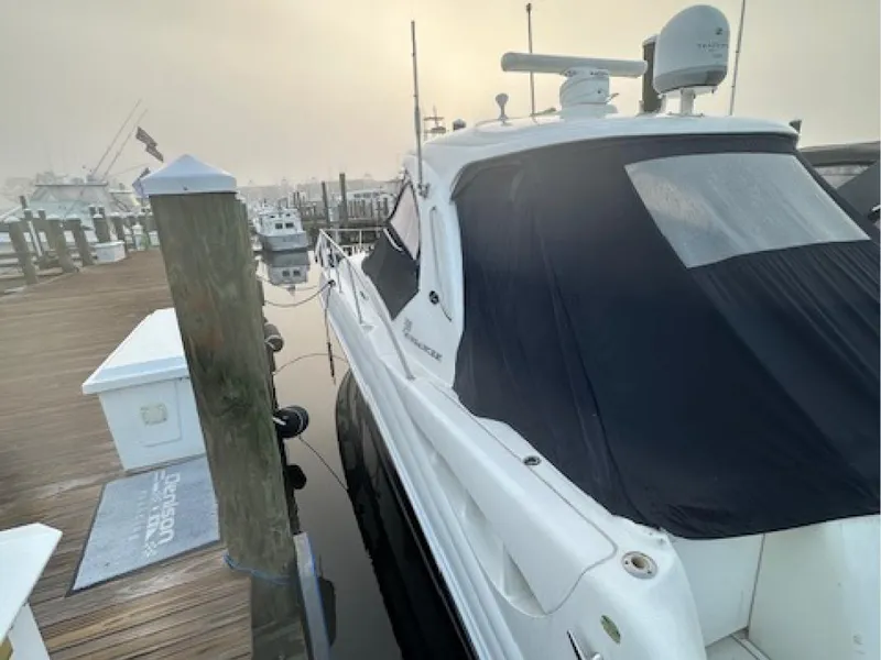 Slide: The Image of 2005 Sea Ray 390 Sundancer docked at marina in misty morning light. - 2