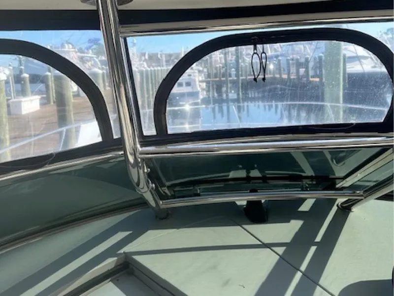 Slide: The Image of Interior view of 2005 Sea Ray 390 Sundancer yacht with marina backdrop. - 4