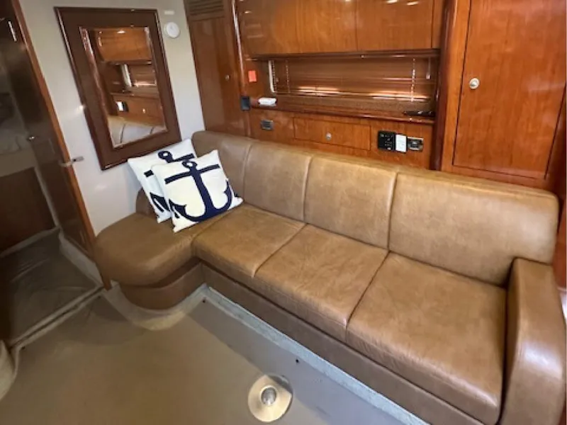 Slide: The Image of Luxurious interior of 2005 Sea Ray 390 Sundancer with leather sofa and nautical decor. - 7