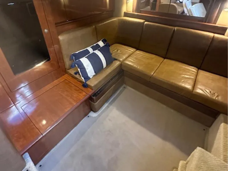 Slide: The Image of Luxurious interior of 2005 Sea Ray 390 Sundancer with leather seating and nautical decor. - 8