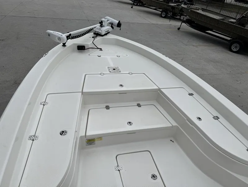 Slide: The Image of 2019 NauticStar 244 XTS boat deck with storage compartments and trolling motor. - 10