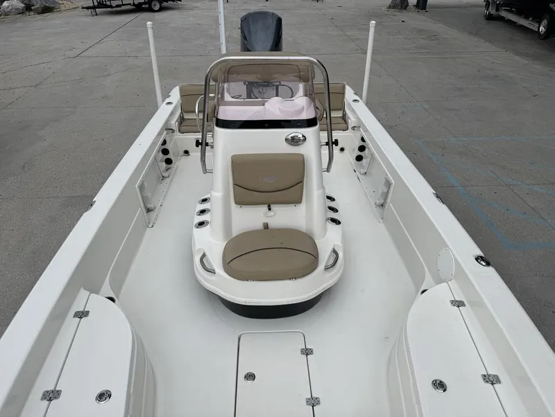 Slide: The Image of 2019 NauticStar 244 XTS boat interior with seating and console. - 11