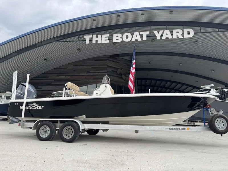 Slide: The Image of 2019 NauticStar 244 XTS boat on trailer at The Boat Yard. - 14