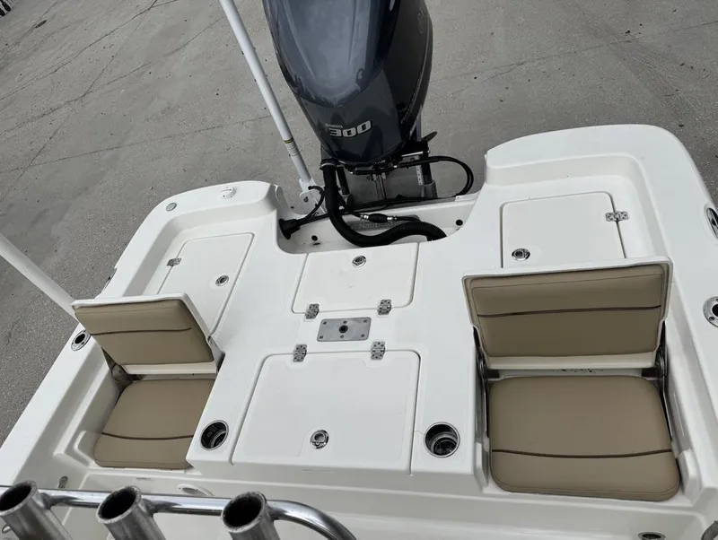 Slide: The Image of 2019 NauticStar 244 XTS boat with seating and powerful outboard motor. - 17