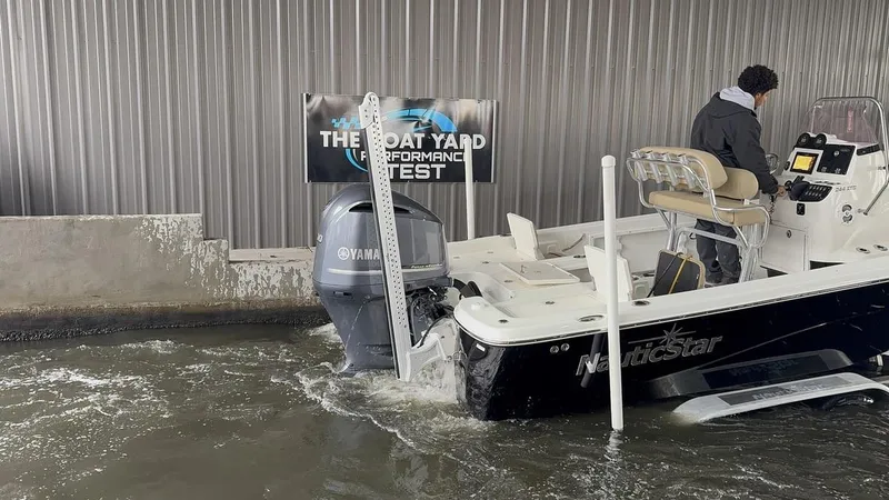 Slide: The Image of 2019 NauticStar 244 XTS boat undergoing performance test in water. - 2
