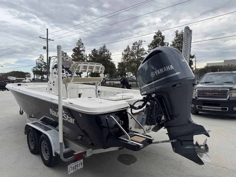 Slide: The Image of 2019 NauticStar 244 XTS boat with Yamaha engine on trailer. - 6
