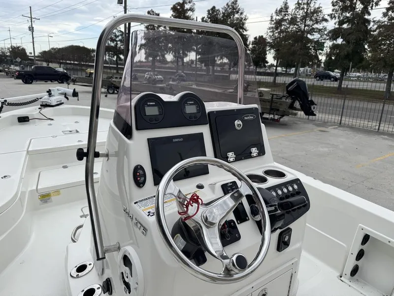 Slide: The Image of 2019 NauticStar 244 XTS boat console with steering wheel and navigation controls. - 7