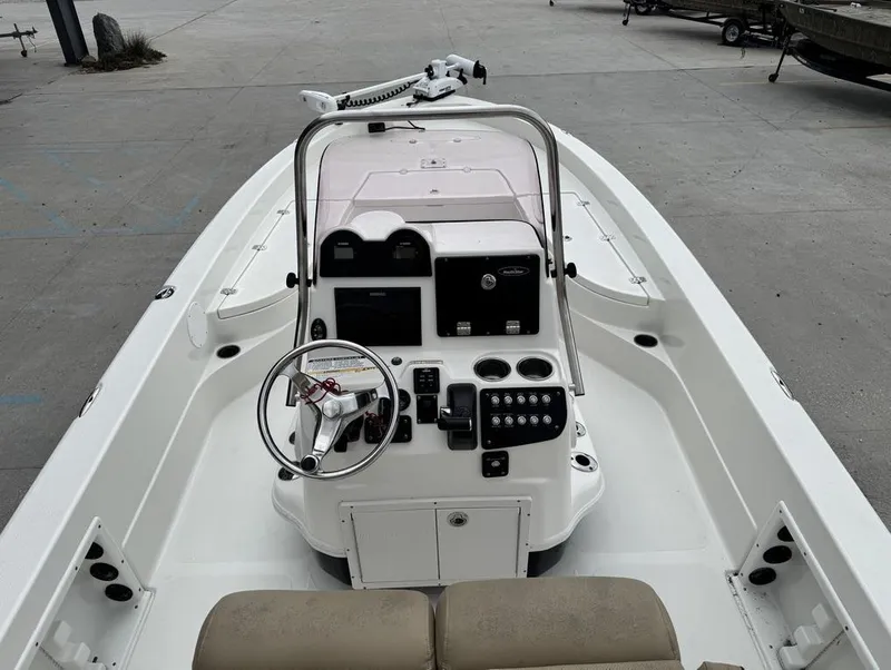 Slide: The Image of 2019 NauticStar 244 XTS boat interior with steering console and controls. - 9