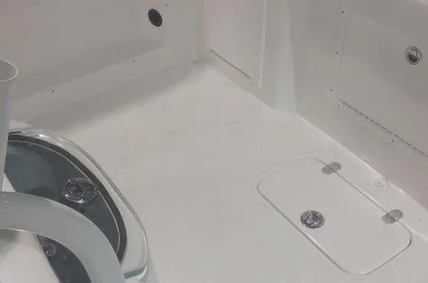 Slide: The Image of 2024 Cape Horn 22OS boat interior with storage compartments and sleek design. - 12