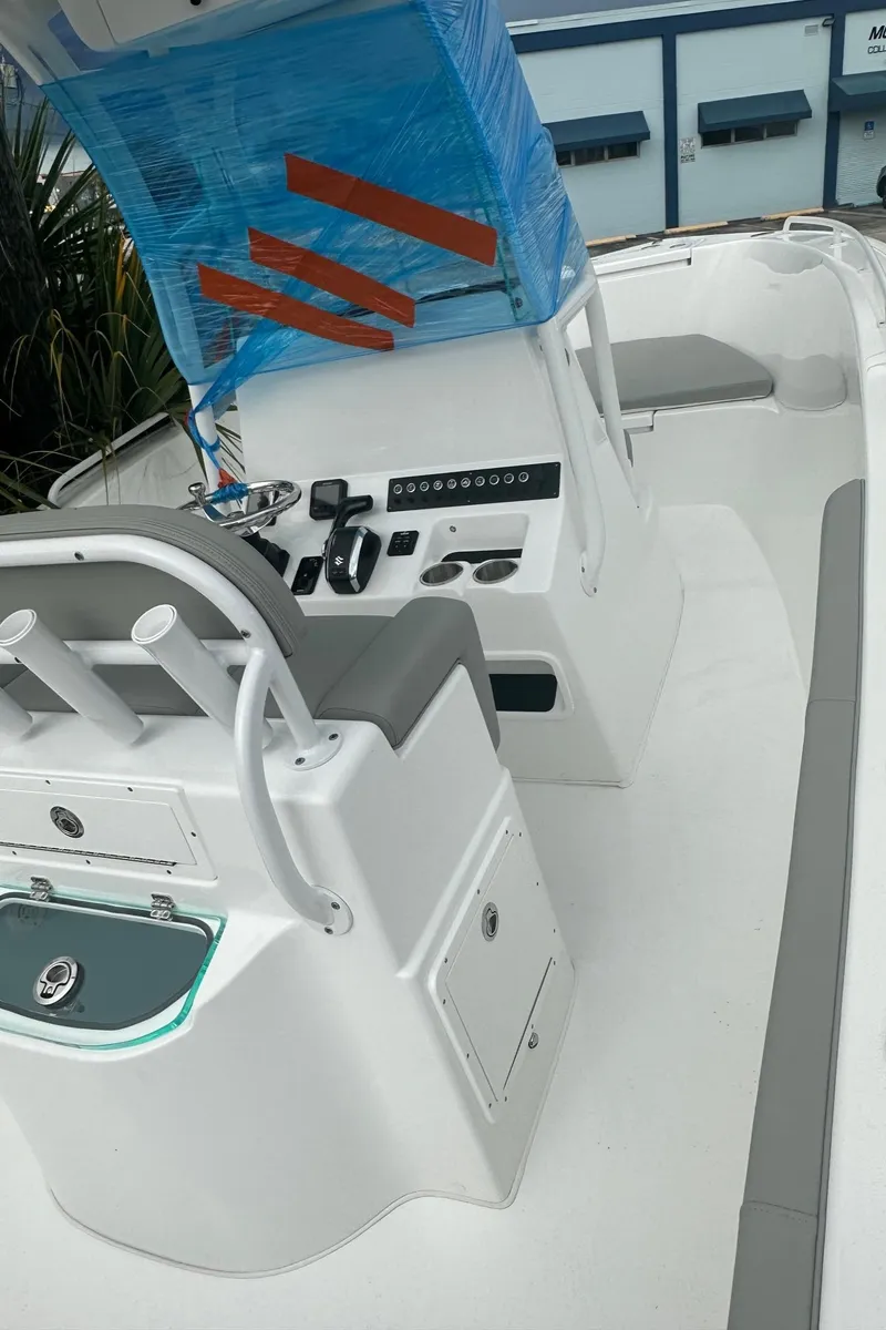 Slide: The Image of 2024 Cape Horn 22OS boat interior with modern console and seating. - 8