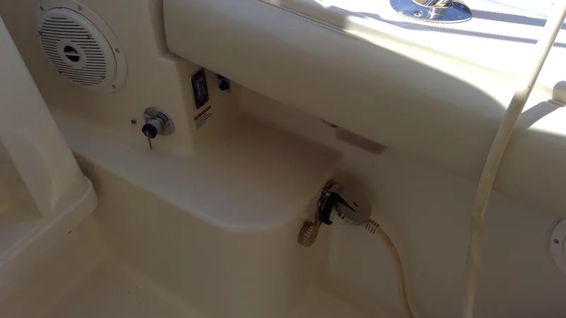 Slide: The Image of Interior view of a 1993 Tiara Yachts 3100 Open, featuring control panel and speaker. - 10