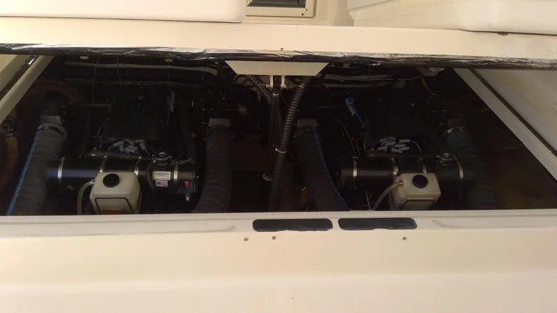 Slide: The Image of 1993 Tiara Yachts 3100 Open engine compartment with dual engines. - 17