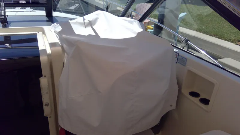 Slide: The Image of 1993 Tiara Yachts 3100 Open interior with covered helm station. - 20