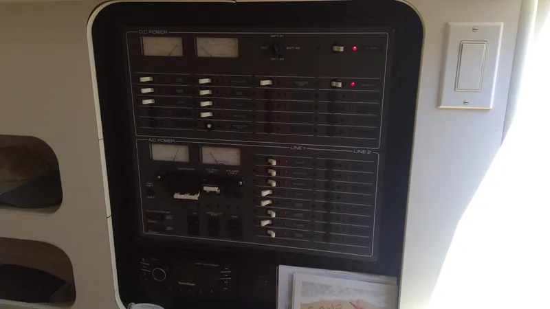Slide: The Image of Electrical panel of 1993 Tiara Yachts 3100 Open boat, featuring switches and meters. - 31