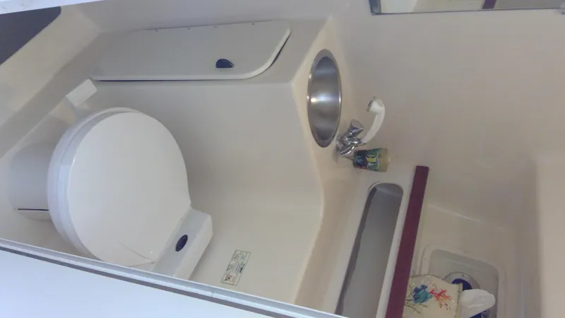 Slide: The Image of 1993 Tiara Yachts 3100 Open bathroom with toilet and sink. - 36