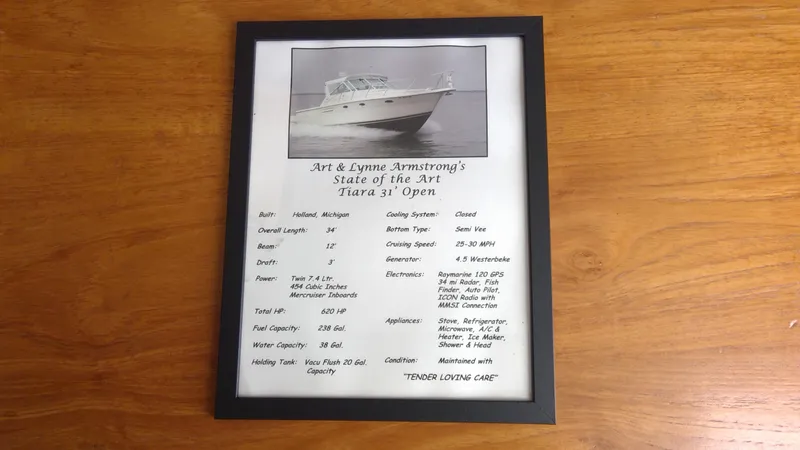 Slide: The Image of Framed specifications of a 1993 Tiara Yachts 3100 Open on wooden table. - 39