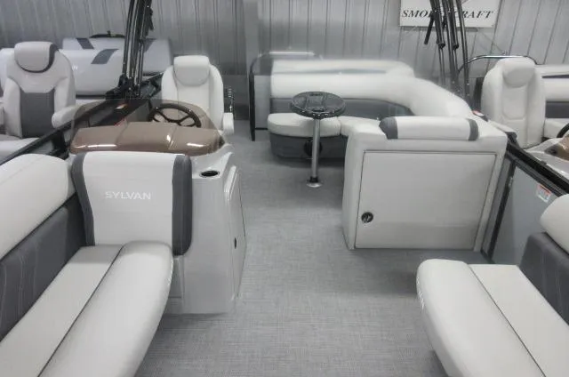 Slide: The Image of 2025 Sylvan Mirage 8520 Cruise interior with plush seating and modern design. - 1