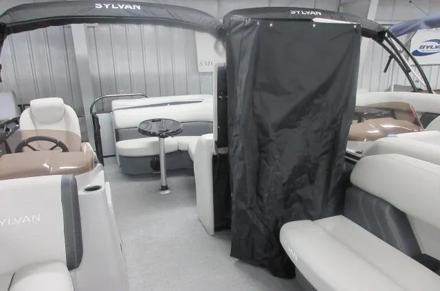 Slide: The Image of 2025 Sylvan Mirage 8520 Cruise interior with seating and table, showcasing modern design. - 3