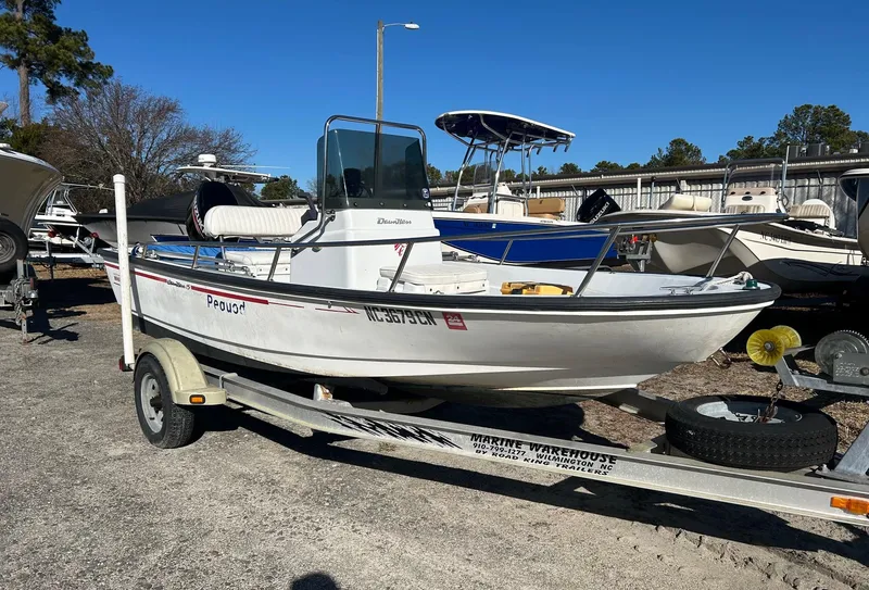 Slide: The Image of 1995 Boston Whaler Dauntless 15 boat on trailer in sunny marina setting. - 3