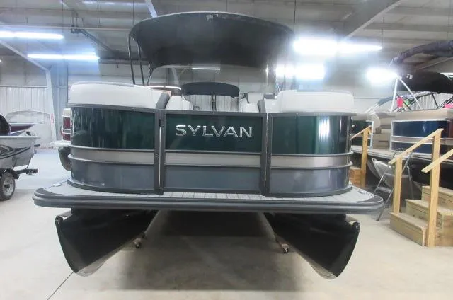 The Image of 2025 Sylvan L1 LZ pontoon boat in indoor showroom, rear view. - 0