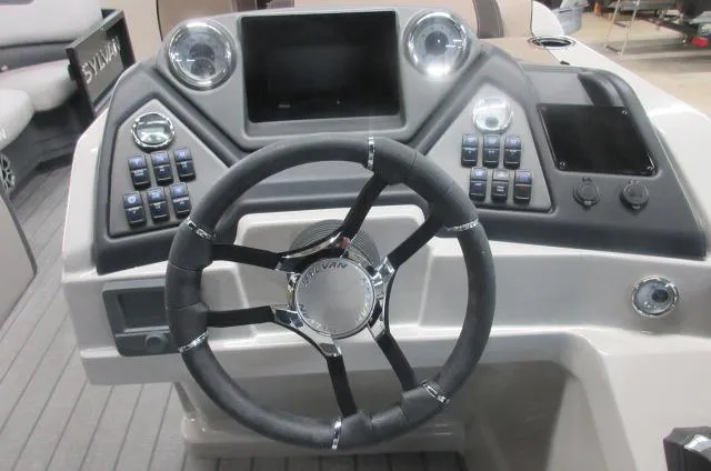 Slide: The Image of 2025 Sylvan L1 LZ boat dashboard with steering wheel and control panel. - 10