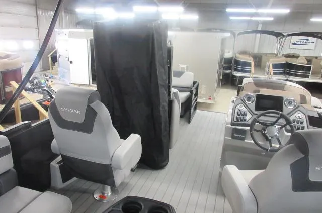 Slide: The Image of Interior of 2025 Sylvan L1 LZ boat with modern seating and control panel. - 12