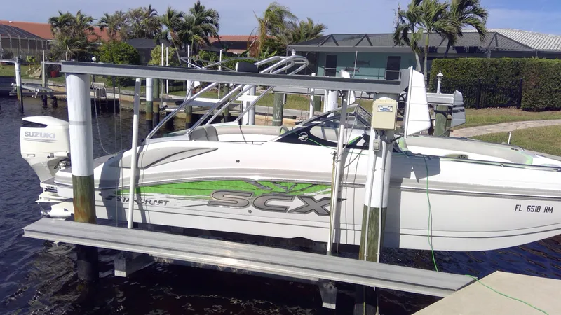 The Image of 2017 Starcraft SCX 240 boat on lift, dockside view. - 1