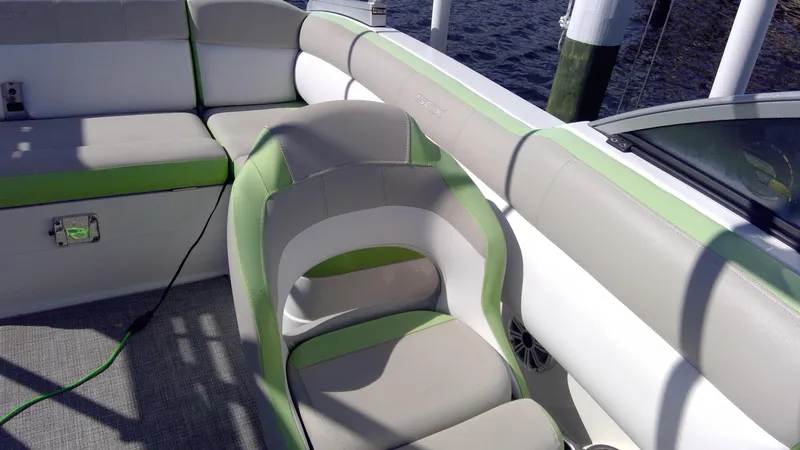 Slide: The Image of 2017 Starcraft SCX 240 boat interior with green and beige seating. - 10