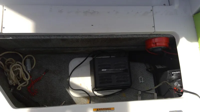 Slide: The Image of Storage compartment of 2017 Starcraft SCX 240 boat with ropes and equipment. - 17