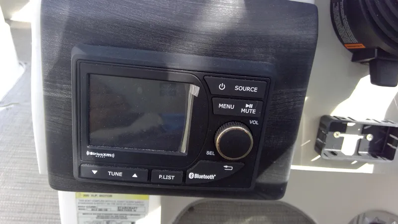Slide: The Image of 2017 Starcraft SCX 240 boat stereo system with Bluetooth and SiriusXM features. - 18