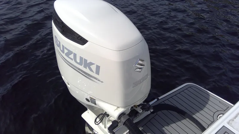 Slide: The Image of Suzuki outboard motor on 2017 Starcraft SCX 240 boat, floating on water. - 27