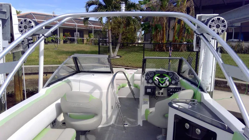 Slide: The Image of 2017 Starcraft SCX 240 boat interior with modern dashboard and seating. - 29