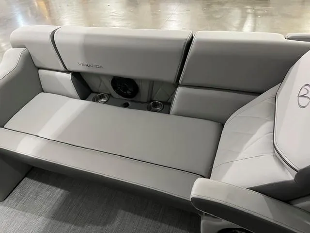 Slide: The Image of Luxurious seating in 2025 Veranda VX 25 DCRC boat, featuring sleek gray upholstery. - 14
